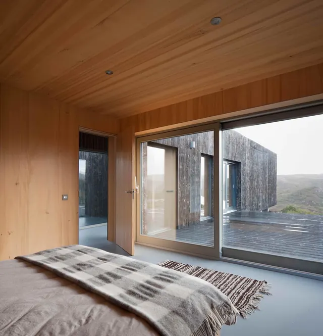 Timber interior with highland landscape view, minimal, organic, warm