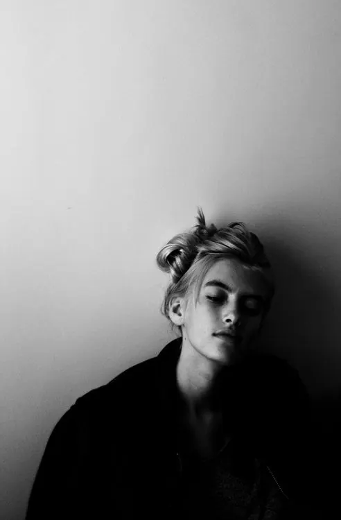 Headshot portrait with dramatic side lighting, photographic, monochrome, monochrome