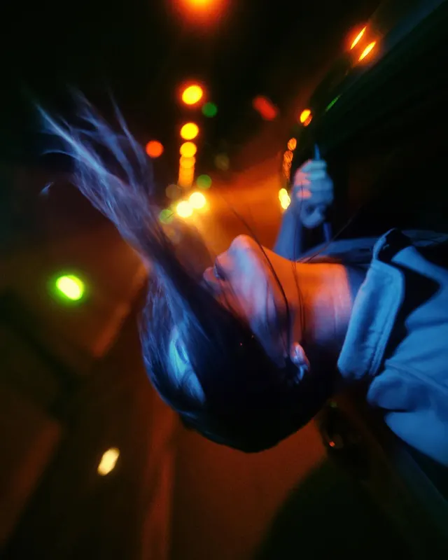 Portrait with glowing bokeh lights and motion blur, photographic, artistic, vibrant