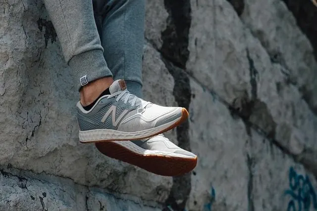 Sneaker on textured concrete step, photographic, technical, light