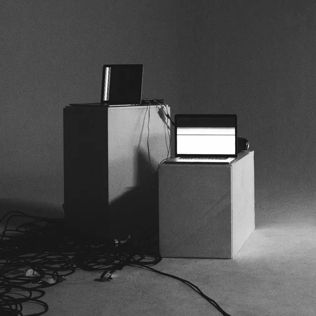 Minimalist monochrome tech setup photograph, minimalist, monochrome, dark