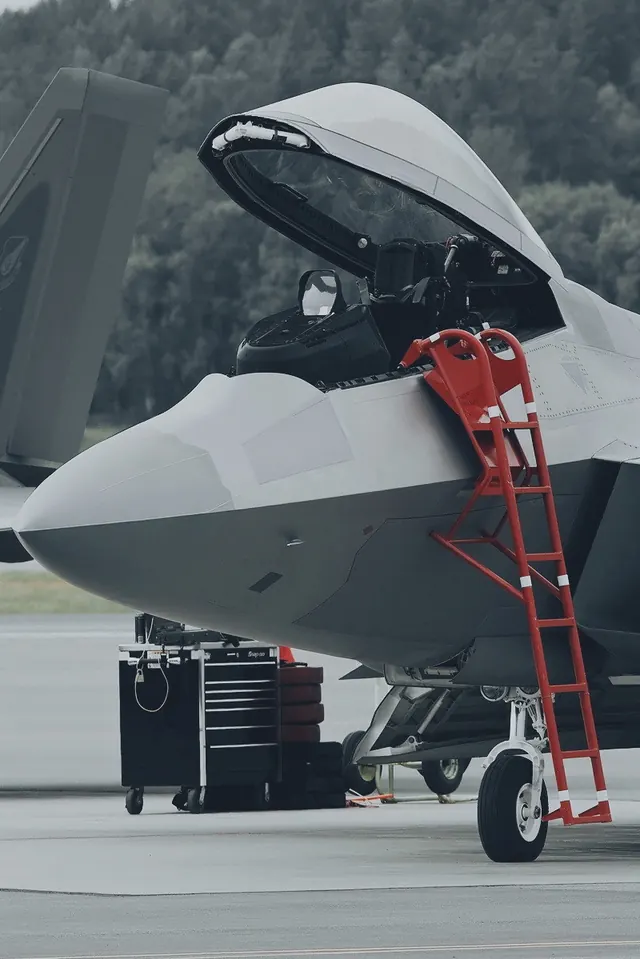 Military cargo aircraft nose inspection, photographic, technical, dark