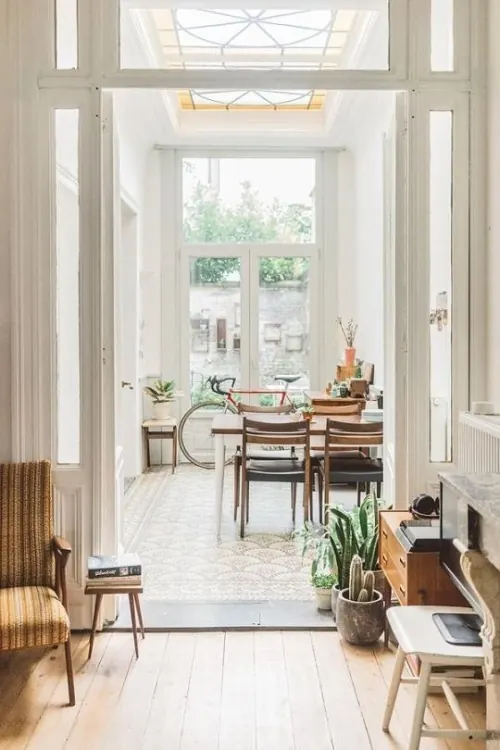 Sunlit hallway with mid-century furnishings, minimal, organic, light