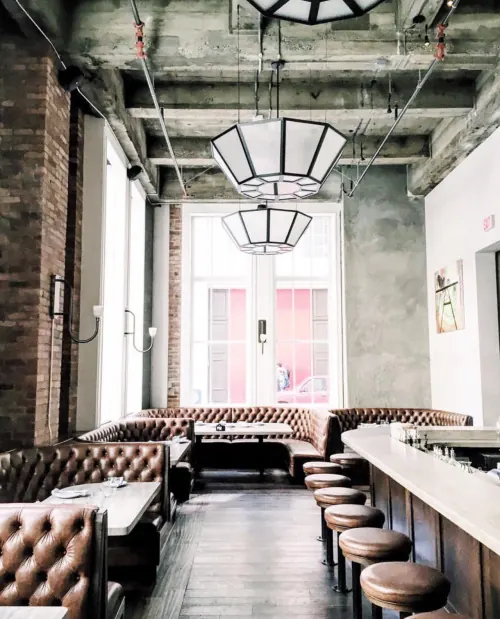 Brutalist interior restaurant space, brutalist, photographic, warm