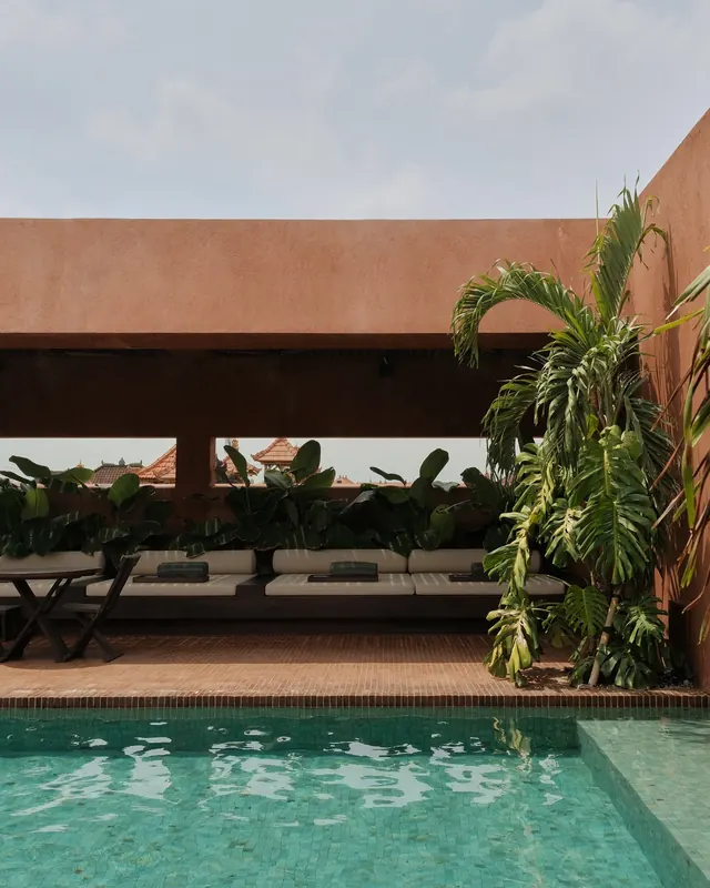 Minimalist poolside terrace with brutalist overhang, minimal, brutalist, warm