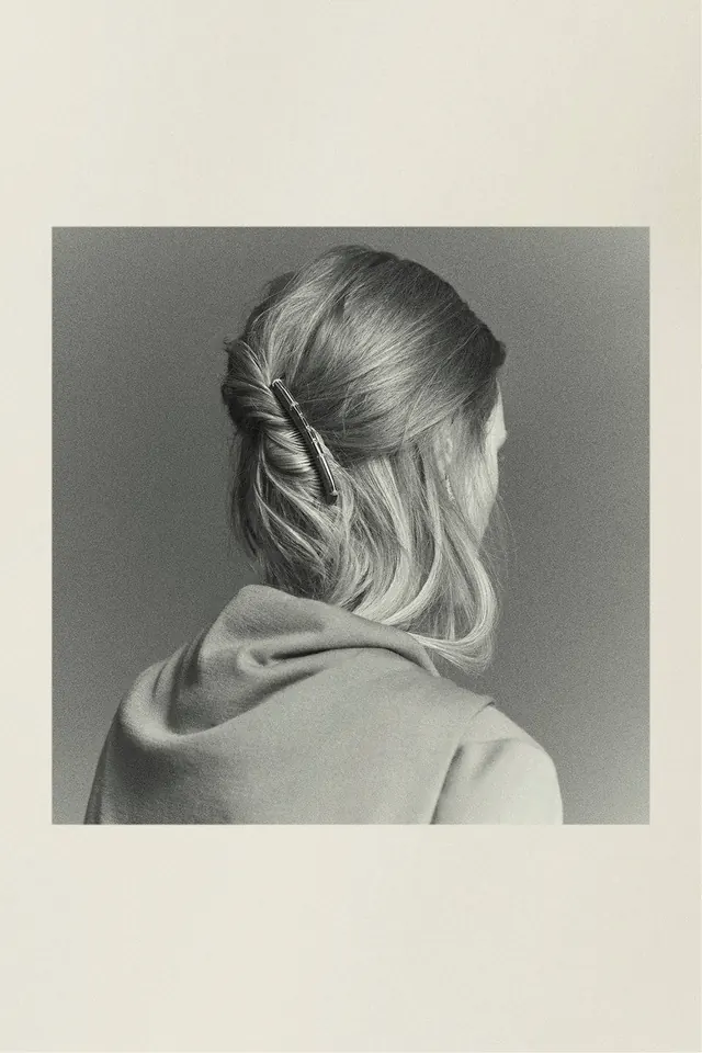 Back-view portrait with twisted half-up hairstyle, photographic, editorial, light