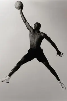 Athlete jumping with basketball, photographic, technical, light