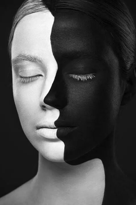Split-face portrait study, monochrome, minimal, dark