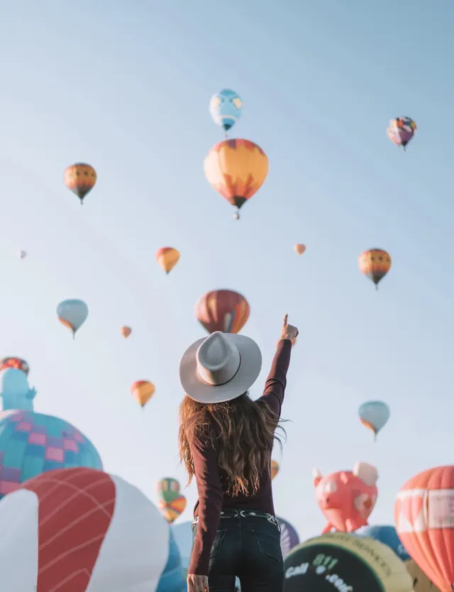 Hot air balloon festival overhead shot, photographic, editorial, warm