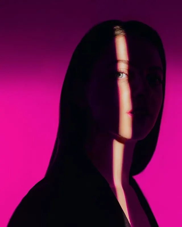 Neon-lit silhouette portrait, photographic, dark-mode, vibrant
