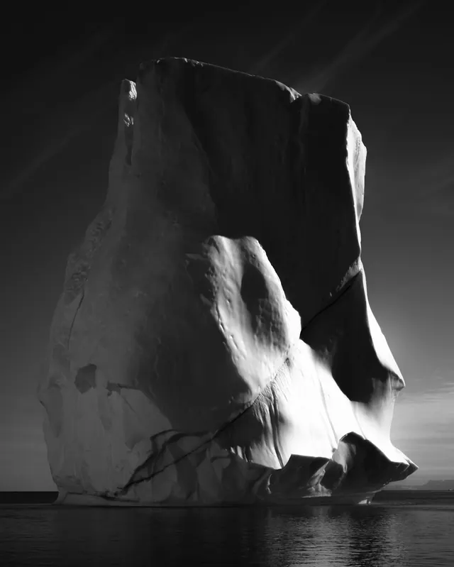 Monochromatic iceberg in arctic seascape, photographic, high-contrast, monochrome