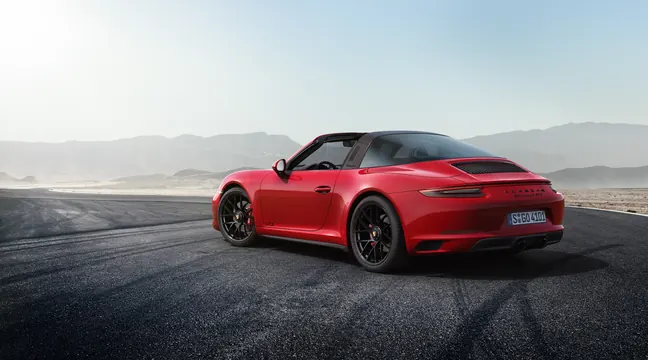 Porsche 911 GTS red convertible—landscape, photographic, luxury, vibrant