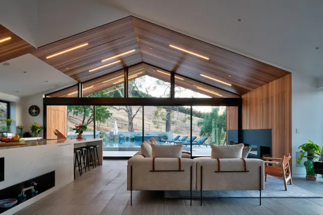 Modern residential living space with ceiling reveal, minimal, corporate-clean, warm