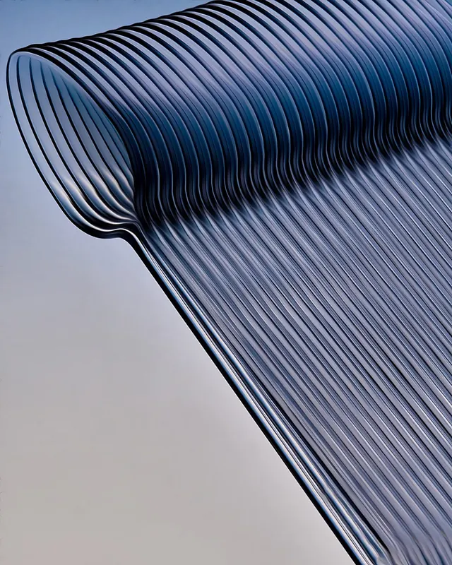 Blue ribbed metal architectural form, photographic, abstract, cool