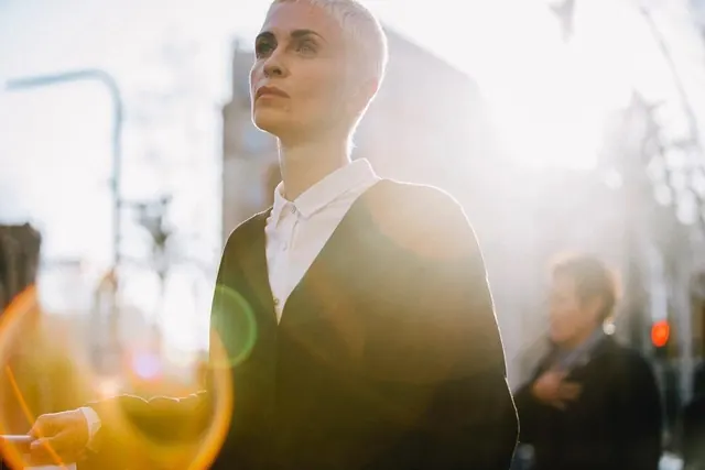 Portrait of a man in a suit with lens flare