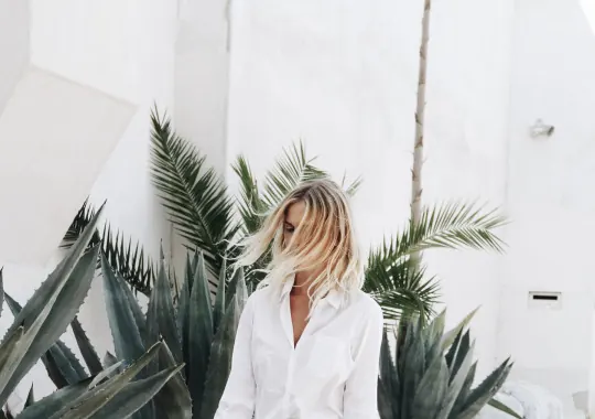 Woman in White among Tropical Foliage