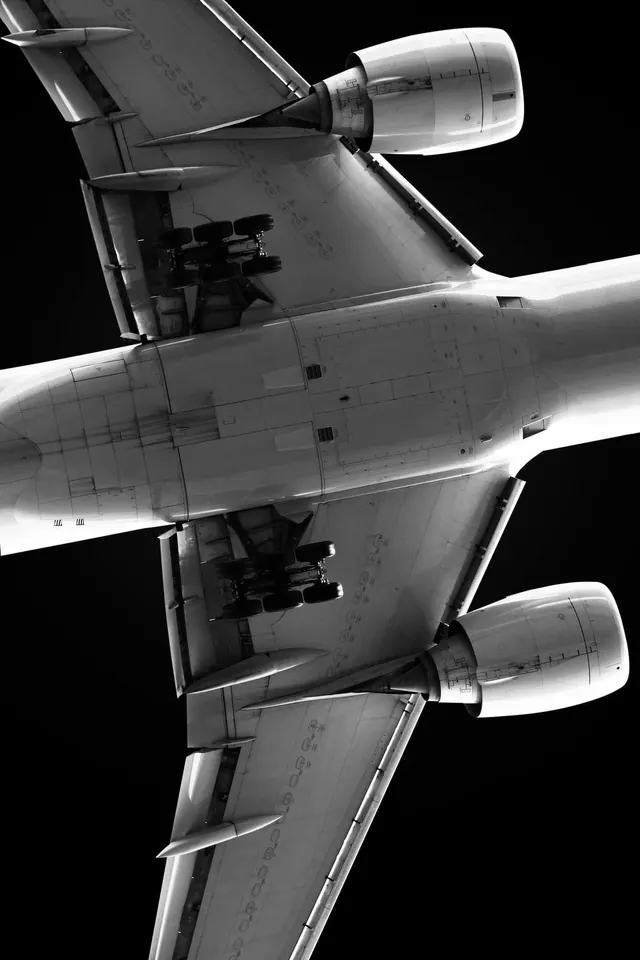 Airplane underside symmetrical lookup, technical, photographic, monochrome