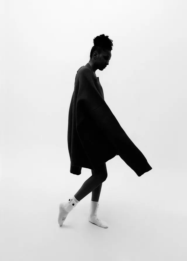 Oversized sweater fashion profile stride, editorial, photographic, monochrome
