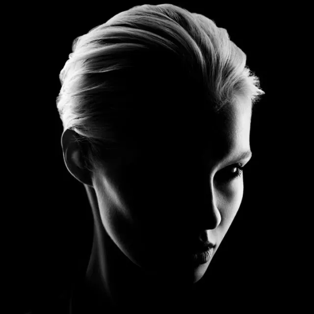 High-Contrast Portrait of Woman with Slicked Hair, editorial, minimal, monochrome