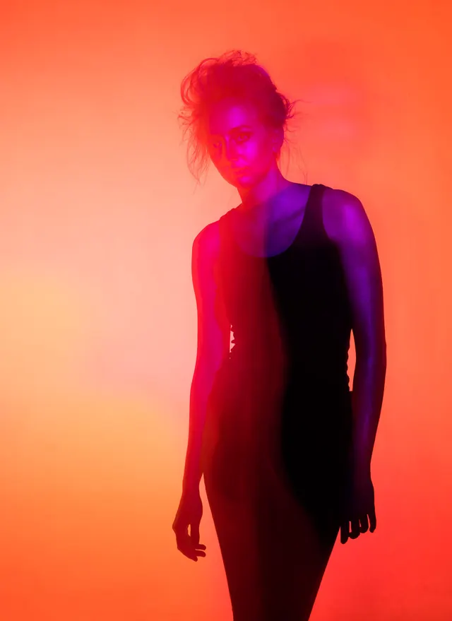 Fashion Portrait Lit with Red and Purple Gels, editorial, vibrant