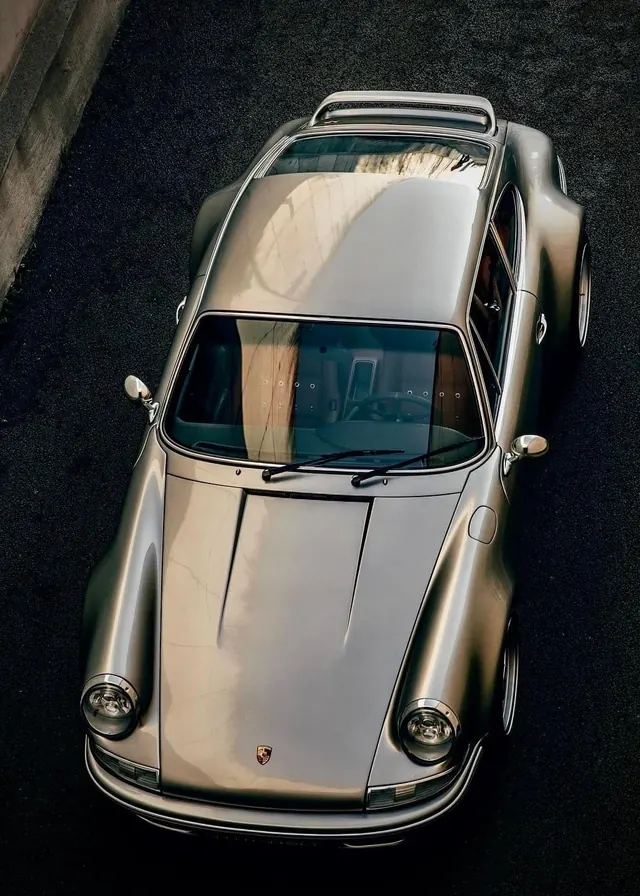 Silver Porsche 911 top-down view, photographic, minimal, muted