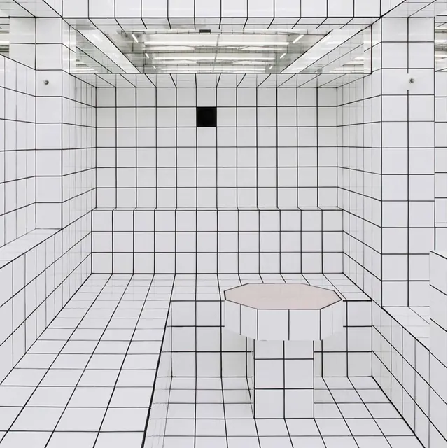 All-white tiled grid room, minimal, brutalist, light