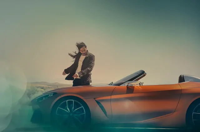 Man with Vintage Sports Car