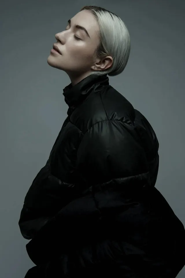Platinum profile in black puffer, minimal, photographic, monochrome