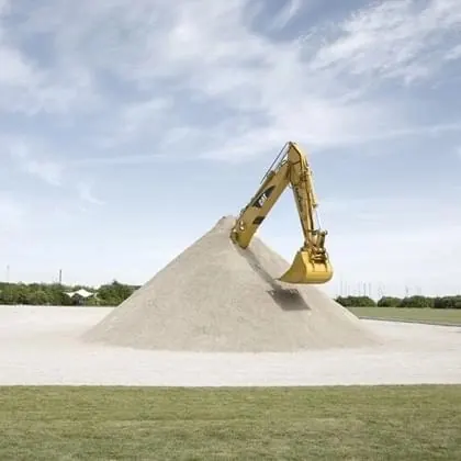 Excavator on Sand Pile
