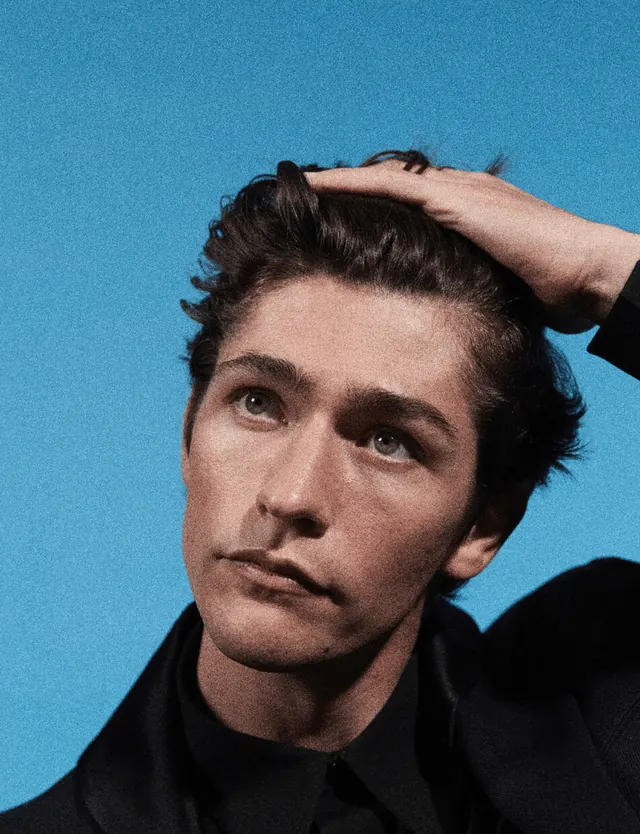 Portrait of a man against blue background