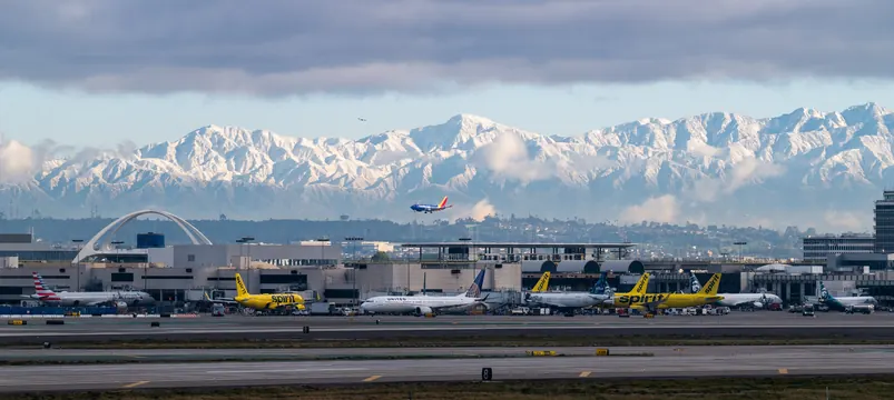 LAX planes before snowy mountains, photographic, technical, cool
