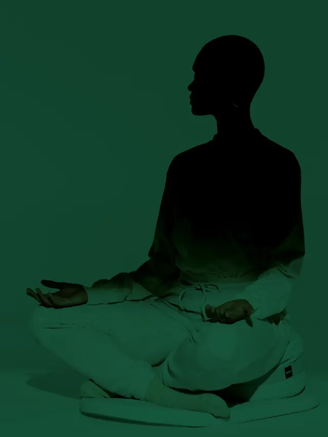 Green monochrome meditation scene, minimal, photographic, dark