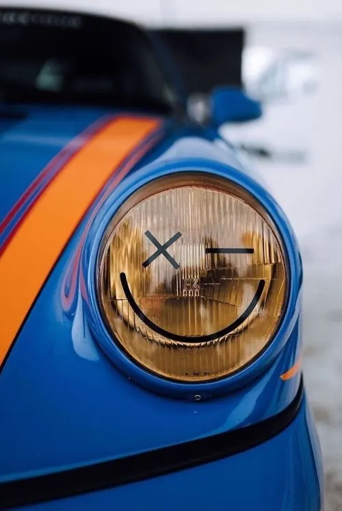 Headlight smiley face car, photographic, playful, vibrant
