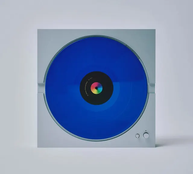 Monolith turntable with blue vinyl, minimal, technical, muted