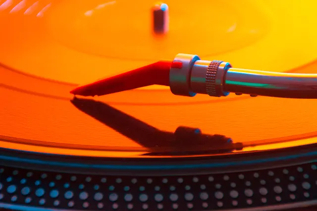 Orange vinyl on turntable macro, photographic, retro, warm