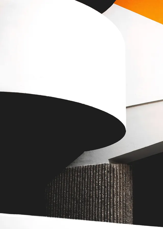 High-contrast architectural curve and ribbed concrete, minimal, geometric, monochrome