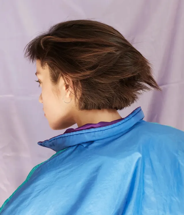 Portrait of a person in blue garment