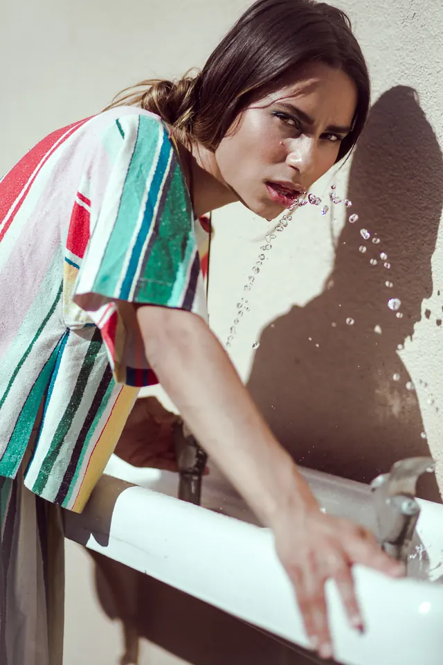 Portrait of a woman with a sink