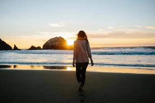 Woman on Beach at Sunset