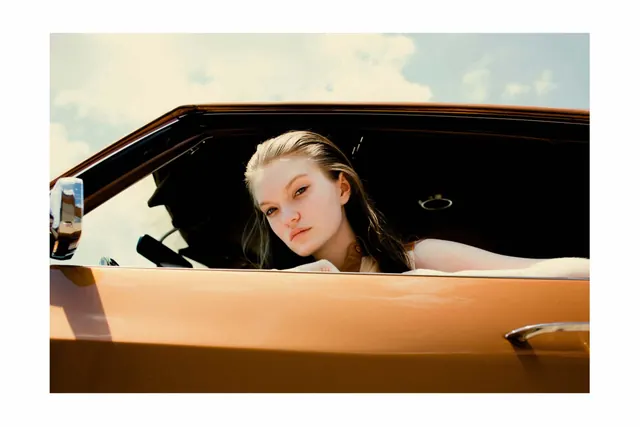 Woman in Vintage Car
