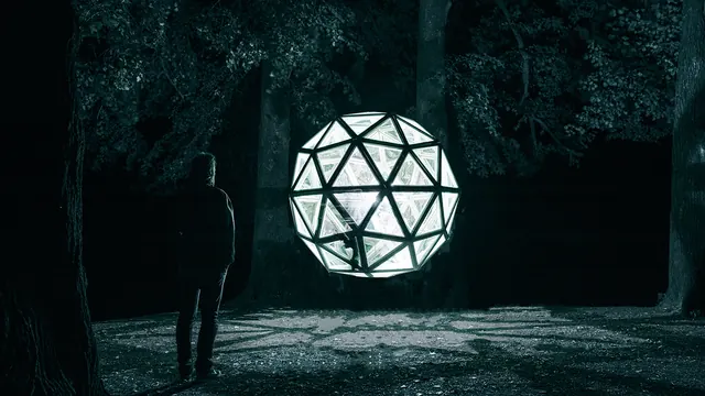 Glowing Geometric Sphere in Forest
