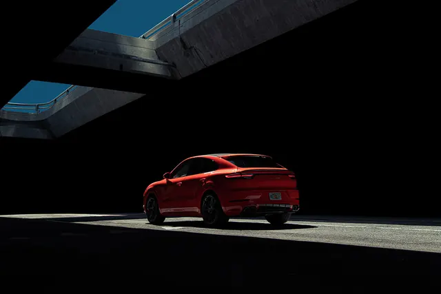 Red Car in Dark Environment