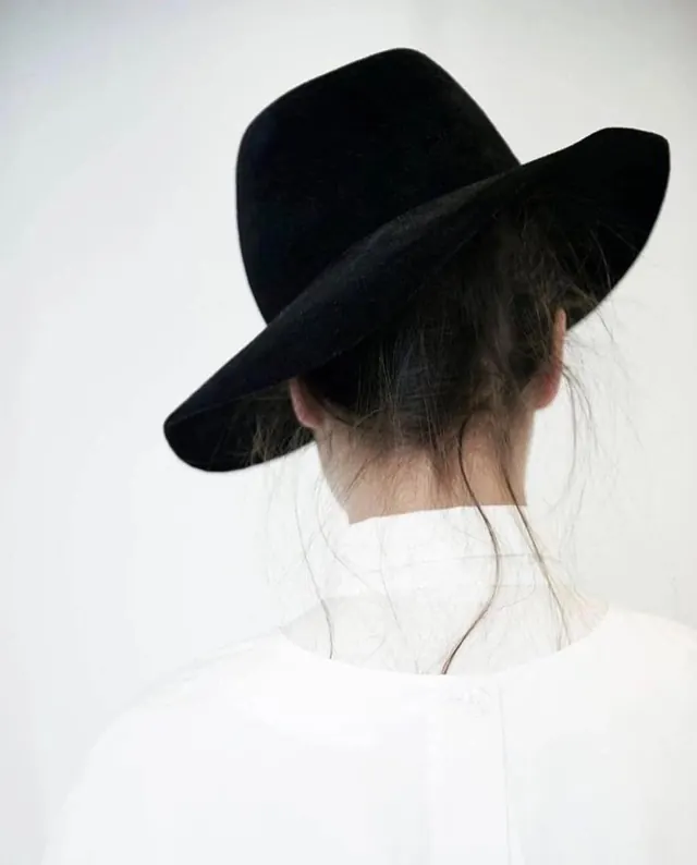 Portrait of Woman in Black Hat