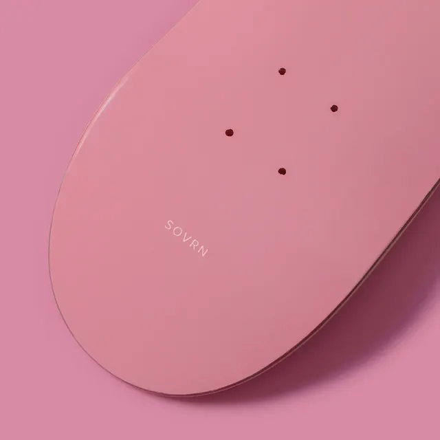 Sovrn pink skateboard deck, minimal, flat, pastel
