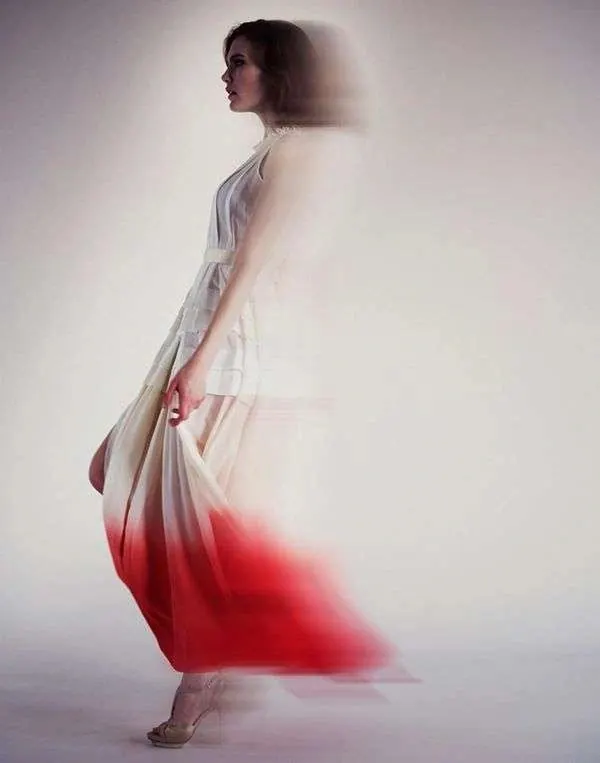 Motion blur fashion portrait in gradient dress, photographic, abstract, warm