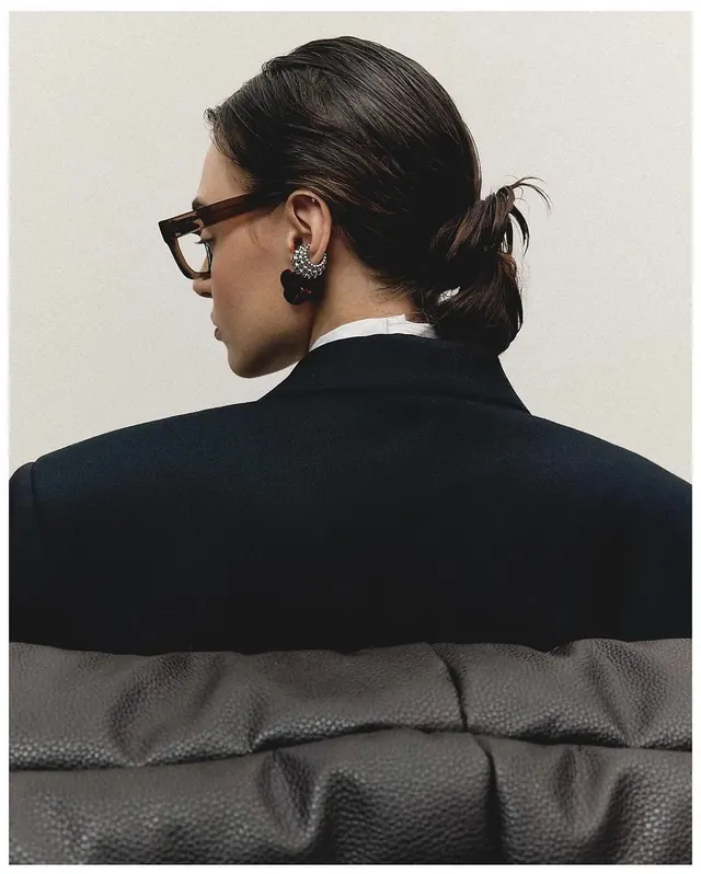 Portrait of a person in a dark blazer