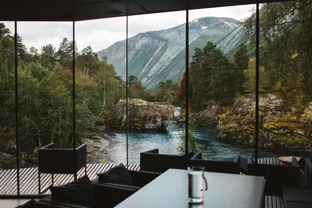 Juvet modern interior with mountain river view, minimal, photographic, dark