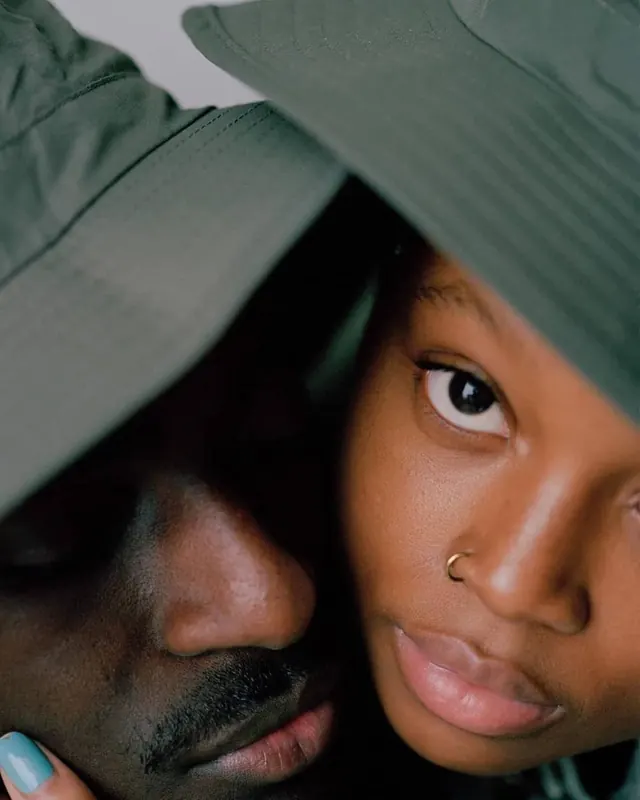 Close-up portrait with fabric overlay, photographic, warm