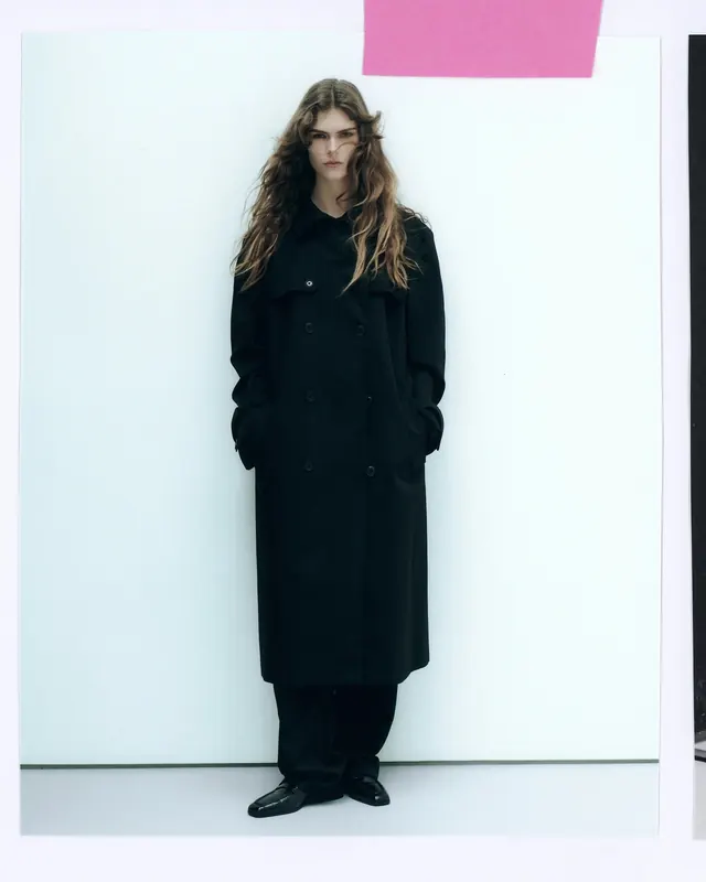 Fashion portrait against minimalist wall, photographic, minimal, dark