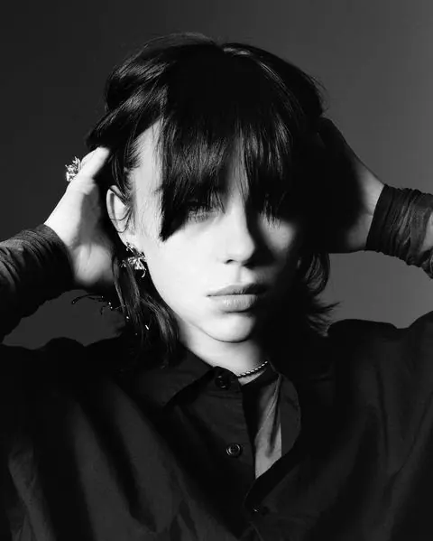 Black and white portrait with dramatic side lighting, photographic, portrait, monochromatic
